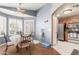 Inviting dining area with a ceiling fan and shutters, conveniently located near the kitchen at 10659 W Yukon Dr, Peoria, AZ 85382