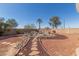 Backyard with a custom-designed rock garden and desert landscaping at 10659 W Yukon Dr, Peoria, AZ 85382