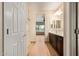 Bathroom featuring double sink vanity, shower, and stylish fixtures at 10859 E Thatcher Ave, Mesa, AZ 85212