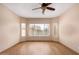 Bedroom offering a ceiling fan and lots of natural light at 10859 E Thatcher Ave, Mesa, AZ 85212