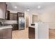 Open kitchen featuring stainless steel appliances, granite countertops, and a pantry at 10859 E Thatcher Ave, Mesa, AZ 85212