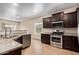 Features of this kitchen are granite countertops, dark wood cabinets and stainless appliances at 10859 E Thatcher Ave, Mesa, AZ 85212
