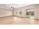 Bright living room with sliding glass doors leading to backyard and lots of windows at 10859 E Thatcher Ave, Mesa, AZ 85212