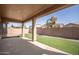 Covered patio with artificial grass, perfect for outdoor entertaining at 10859 E Thatcher Ave, Mesa, AZ 85212
