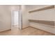 A walk-in closet with built-in shelving and lighting at 10859 E Thatcher Ave, Mesa, AZ 85212