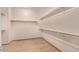 A walk-in closet with built-in shelving at 10859 E Thatcher Ave, Mesa, AZ 85212