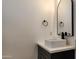 Powder room featuring a vessel sink and arch mirror at 11612 S 211Th Ln, Buckeye, AZ 85326