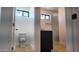 Modern bathroom with a toilet, small window, and glass enclosed shower at 11612 S 211Th Ln, Buckeye, AZ 85326