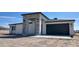 New construction features decorative stone accents at entry and garage with blue sky at 11612 S 211Th Ln, Buckeye, AZ 85326