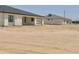Spacious home with white exterior and modern design, complemented by a secure white fence at 11612 S 211Th Ln, Buckeye, AZ 85326