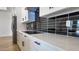 Modern kitchen showcases black cooktop, ample countertop space, and white cabinets at 11612 S 211Th Ln, Buckeye, AZ 85326