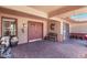 Inviting front entry with double doors, brick paving, and decorative accents at 12423 W Fieldstone Dr, Sun City West, AZ 85375