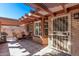 Charming covered patio with outdoor dining set, perfect for relaxing or entertaining guests in style at 12423 W Fieldstone Dr, Sun City West, AZ 85375