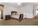 Serene bedroom with a sleigh bed, nightstand, and window offering natural light for a calming atmosphere at 1261 E Nancy Ave, San Tan Valley, AZ 85140