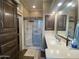 Bathroom with a glass door shower, large mirror, and ample vanity space at 1277 S Shawnee Dr, Apache Junction, AZ 85119