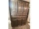 Large dark wooden cabinets featuring ample storage space and modern hardware at 1277 S Shawnee Dr, Apache Junction, AZ 85119
