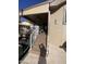 Inviting entrance with a golf cart, stairs with white railings leading to the covered porch at 1277 S Shawnee Dr, Apache Junction, AZ 85119