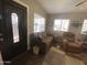 Welcoming entryway with a decorative door leading into a sunlit living space at 1277 S Shawnee Dr, Apache Junction, AZ 85119