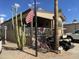 Charming home featuring desert landscaping, golf cart, and covered porch in a friendly community at 1277 S Shawnee Dr, Apache Junction, AZ 85119