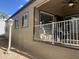 A well maintained home featuring a covered front porch with outdoor seating at 1277 S Shawnee Dr, Apache Junction, AZ 85119