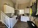 Convenient laundry room with modern washer and dryer units, cabinets, and extra counter space at 1277 S Shawnee Dr, Apache Junction, AZ 85119