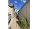 Neat side yard featuring desert landscaping and a paved walkway at 1277 S Shawnee Dr, Apache Junction, AZ 85119