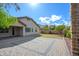 Paver patio and manicured lawn in a well-maintained backyard at 1280 E Redwood Dr, Chandler, AZ 85286