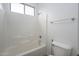 Cozy bathroom with a bathtub-shower combo featuring a pristine white tile surround at 1280 E Redwood Dr, Chandler, AZ 85286