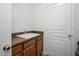 Bright bathroom featuring a vanity with wood cabinets and a white sink at 1280 E Redwood Dr, Chandler, AZ 85286