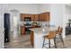 Warm wood cabinets and granite counters adorn this kitchen, complete with stainless appliances and bar seating at 1280 E Redwood Dr, Chandler, AZ 85286