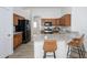 Well-equipped kitchen with granite counters, dark wood cabinets, and stainless steel appliances, offering both style and functionality at 1280 E Redwood Dr, Chandler, AZ 85286
