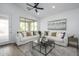 Bright living room with modern decor, ceiling fan and a large window at 1280 E Redwood Dr, Chandler, AZ 85286