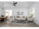 Bright, airy living room with modern decor and stylish ceiling fan at 1280 E Redwood Dr, Chandler, AZ 85286