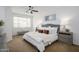 Cozy main bedroom with a ceiling fan, window, and stylish furnishings, creating a peaceful and relaxing atmosphere at 1280 E Redwood Dr, Chandler, AZ 85286