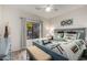 Stylish bedroom with a decorative bedframe, eye-catching geometric bedding and ceiling fan at 13644 N Saguaro Blvd # 103, Fountain Hills, AZ 85268