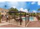 Community pool area with shaded seating and lush desert landscaping at 13644 N Saguaro Blvd # 103, Fountain Hills, AZ 85268