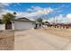 Spacious driveway leading to a well-maintained two-car garage at 16810 N 65Th Pl, Scottsdale, AZ 85254