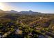 Stunning aerial view featuring winding roads, luxury homes, and mountain views at 16856 N Mountain Pkwy, Fountain Hills, AZ 85268
