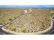 Elevated aerial view revealing a community nestled among hills and sparse natural desert landscape at 16856 N Mountain Pkwy, Fountain Hills, AZ 85268