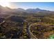 Sprawling aerial shot of the desert landscape featuring winding roads and luxurious homes at 16856 N Mountain Pkwy, Fountain Hills, AZ 85268