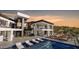 Stunning modern home featuring a private pool, outdoor lounge, and sleek architectural design at 16856 N Mountain Pkwy, Fountain Hills, AZ 85268