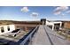 Modern home with multi-car garage, unique walkway and desert landscaping seamlessly blending with the environment at 16856 N Mountain Pkwy, Fountain Hills, AZ 85268
