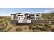 Contemporary home with a pool, outdoor seating, waterfall and tiered landscaping in desert setting at 16856 N Mountain Pkwy, Fountain Hills, AZ 85268