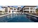 Resort-style backyard features a swimming pool, lounge chairs, an outdoor seating area, and desert landscape at 16856 N Mountain Pkwy, Fountain Hills, AZ 85268