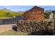 Stone 'Trail Head' sign marking the entrance to a desert community with mountain views at 16856 N Mountain Pkwy, Fountain Hills, AZ 85268