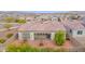 Aerial view showcases backyard with trees, patio, and roof with tile at 18059 W Tanglewood Dr, Goodyear, AZ 85338