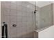 Modern bathroom featuring a glass-enclosed shower with tiled walls and sleek hardware at 18059 W Tanglewood Dr, Goodyear, AZ 85338