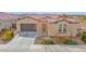 Charming single-story home featuring a well-maintained yard, desert landscaping, and a two-car garage at 18059 W Tanglewood Dr, Goodyear, AZ 85338