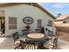 Backyard featuring a patio with a large table and chairs, perfect for entertaining at 20615 N 105Th Ave, Peoria, AZ 85382