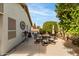 Backyard featuring a patio with dining set, ideal for relaxation and entertaining at 20615 N 105Th Ave, Peoria, AZ 85382